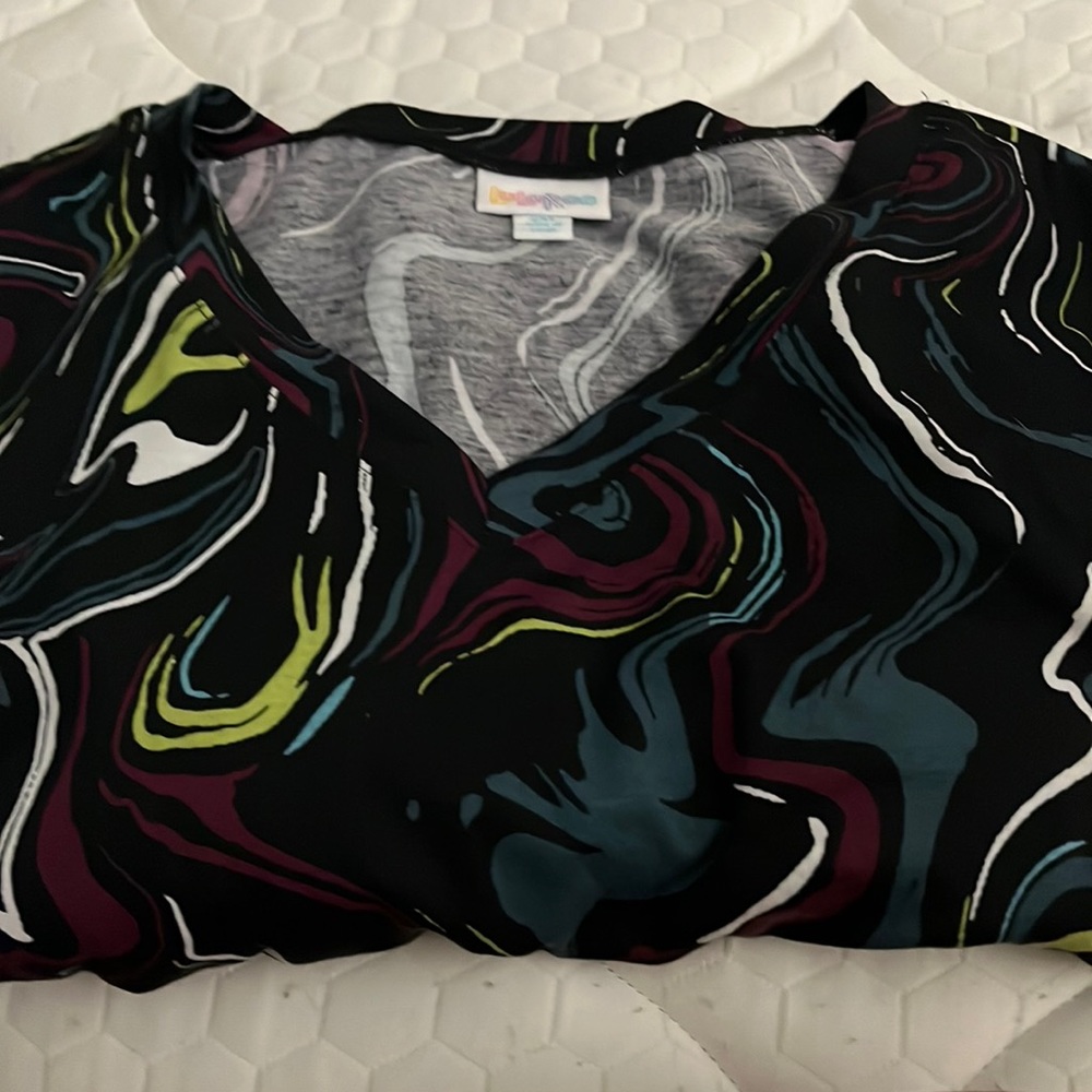 Vibrant multi color on black background. Emily swing dress. Long sleeves